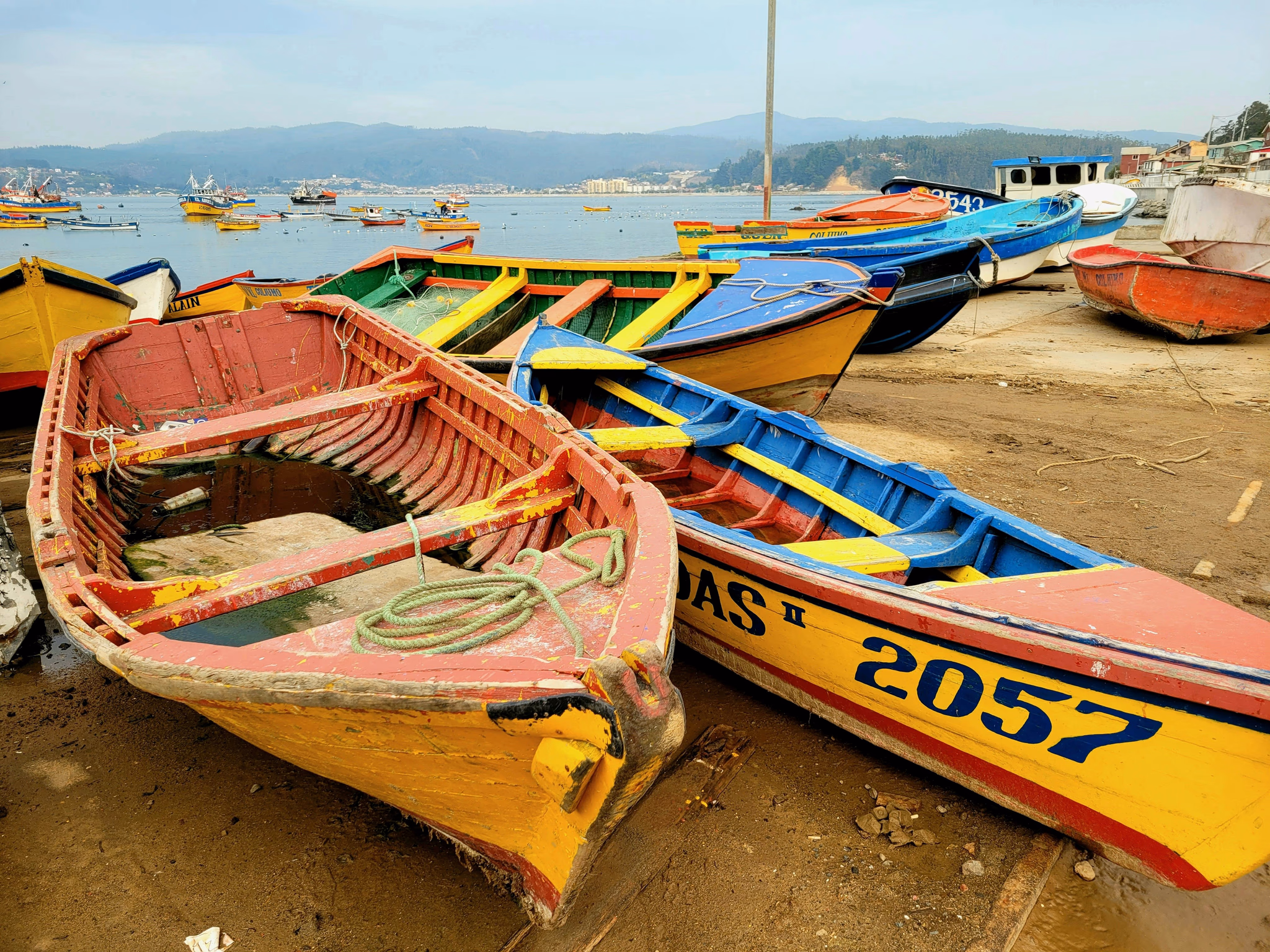 Colorful fishing boats pulled up on a beach
