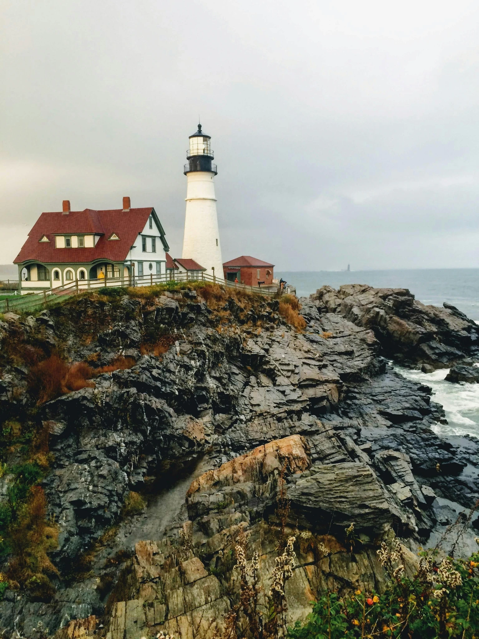 A lighthouse on a rocky headland