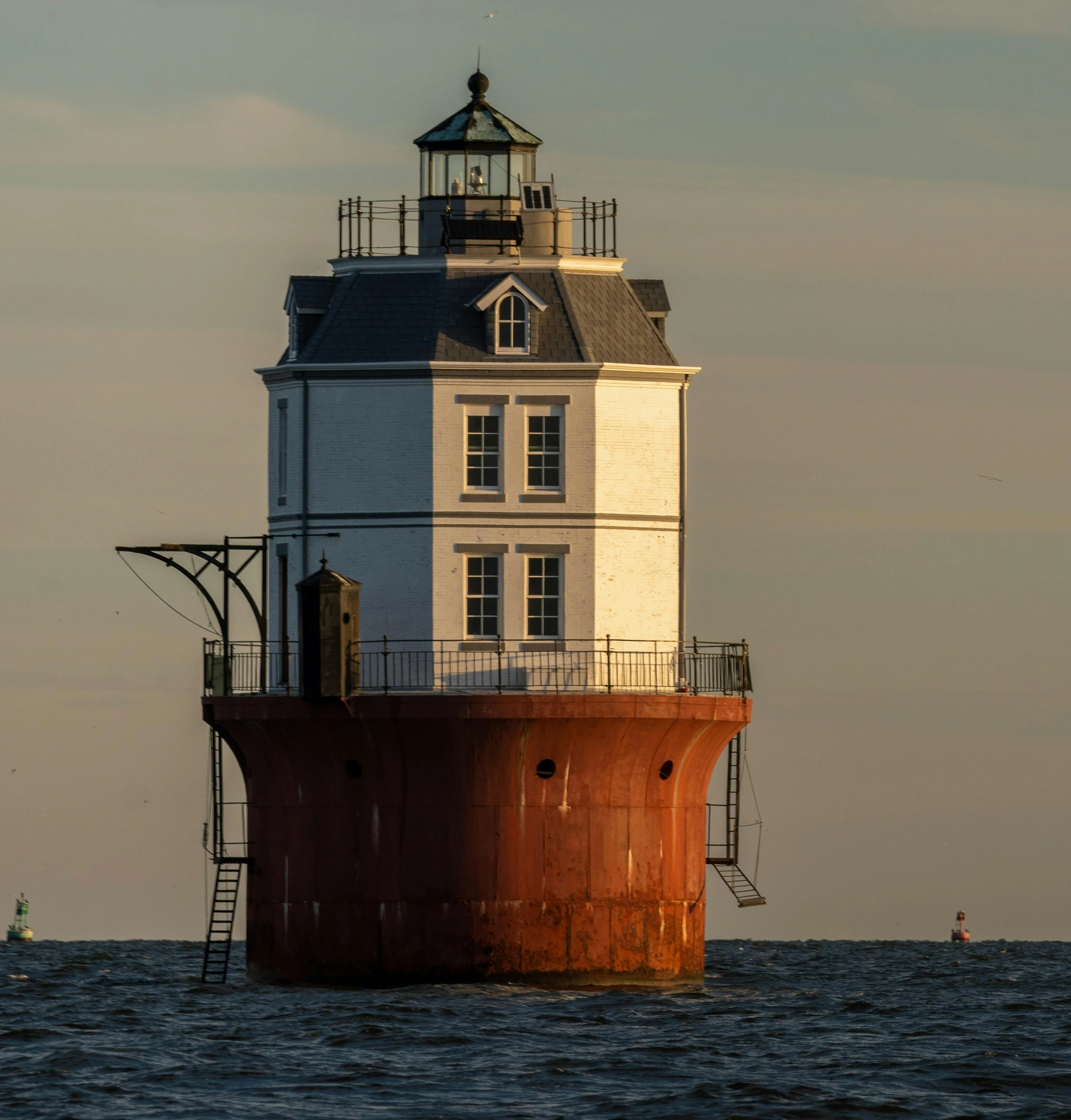 A lighthouse standing in open water