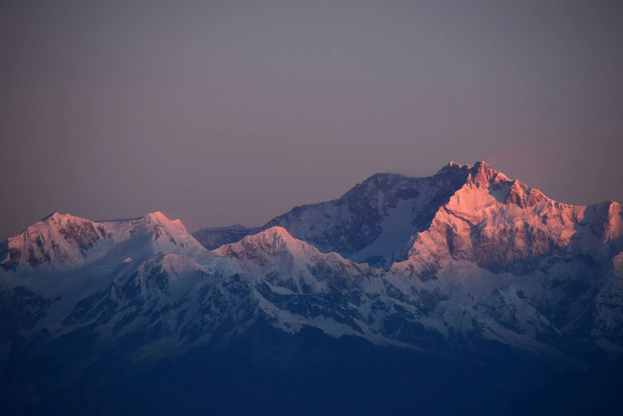 Snow-covered mountains at dusk