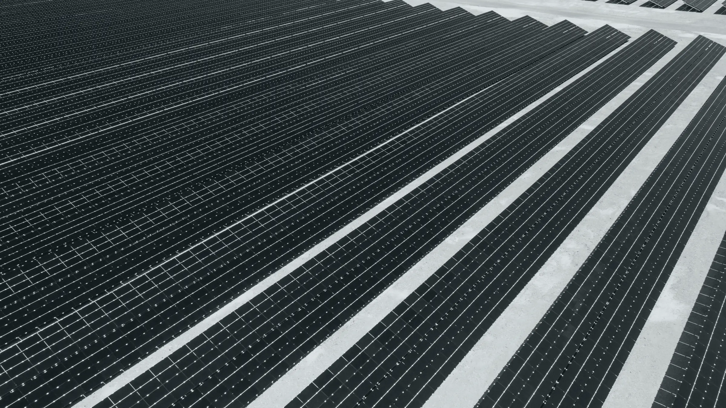Rows of solar panels in a solar farm, seen from above